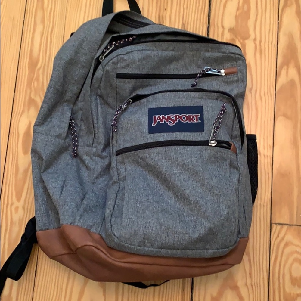 Jansport back pack grey leather bottom